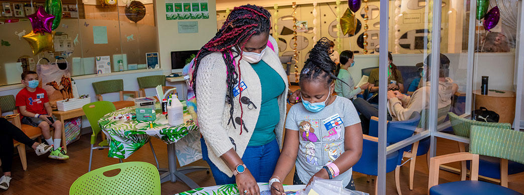 pediatric patient and her mother in the Jimmy Fund Clinic