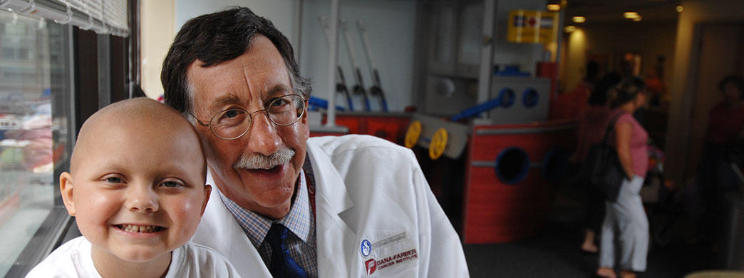 Stephen Sallan, MD, with a pediatric patient in the Jimmy Fund Clinic