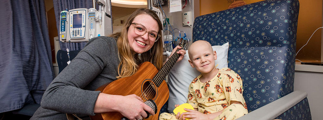 music therapist with a pediatric patient